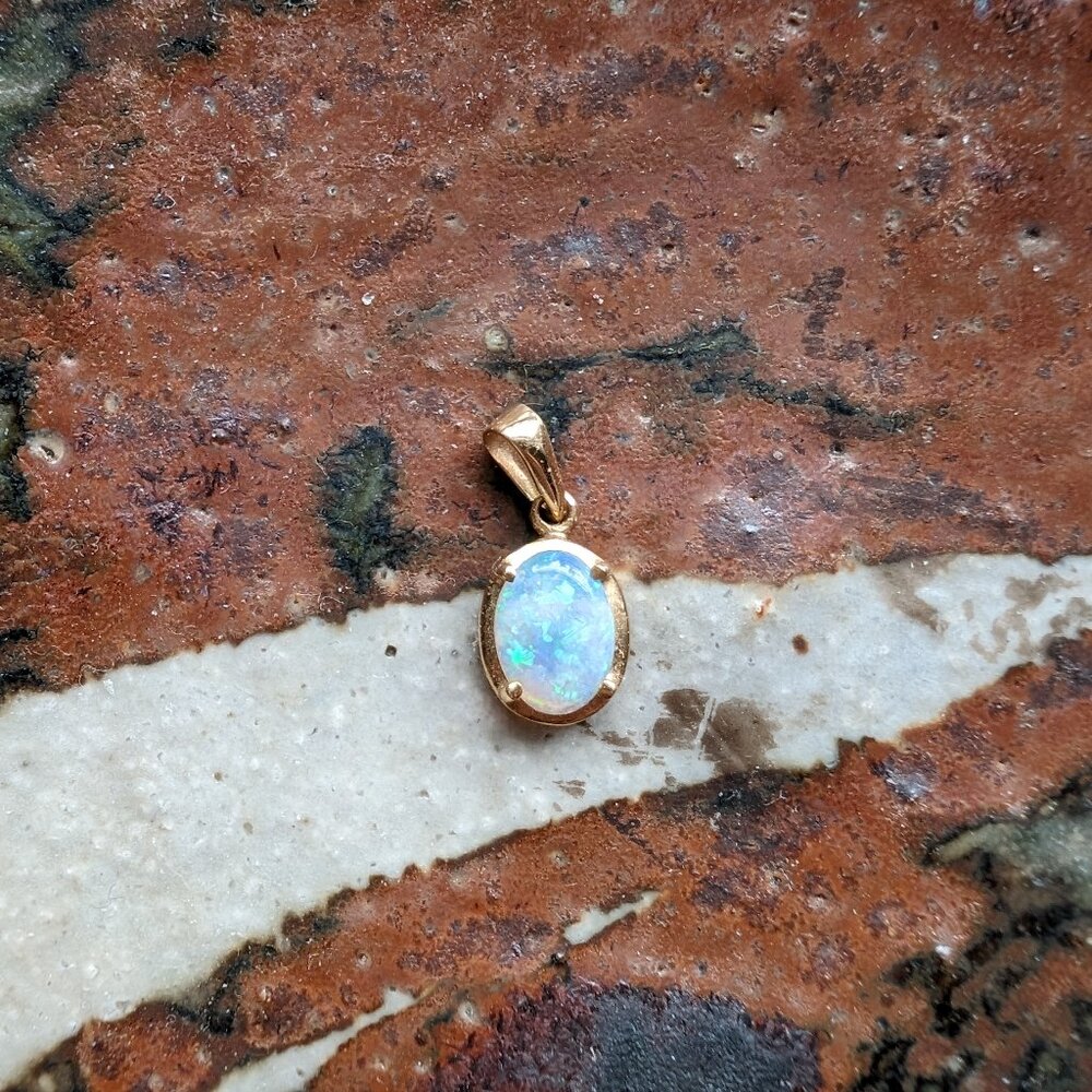 Gold opal charm